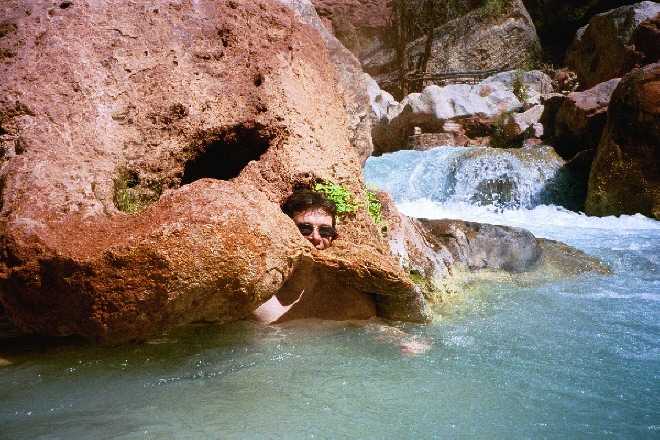 Conor hidden inside a rock at Havasu creek