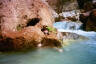 Conor hidden inside a rock at Havasu creek